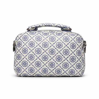 White handbag with blue geometric pattern on a white background