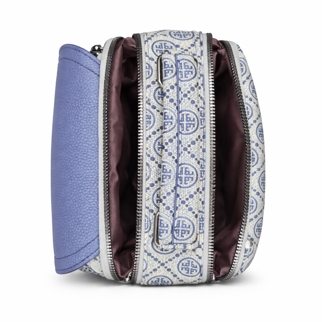 Patterned handbag with a blue interior on a white background