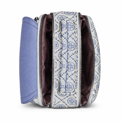 Patterned handbag with a blue interior on a white background