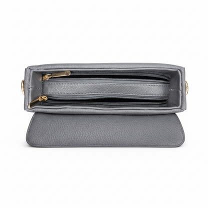 Gray handbag with gold accents on a white background