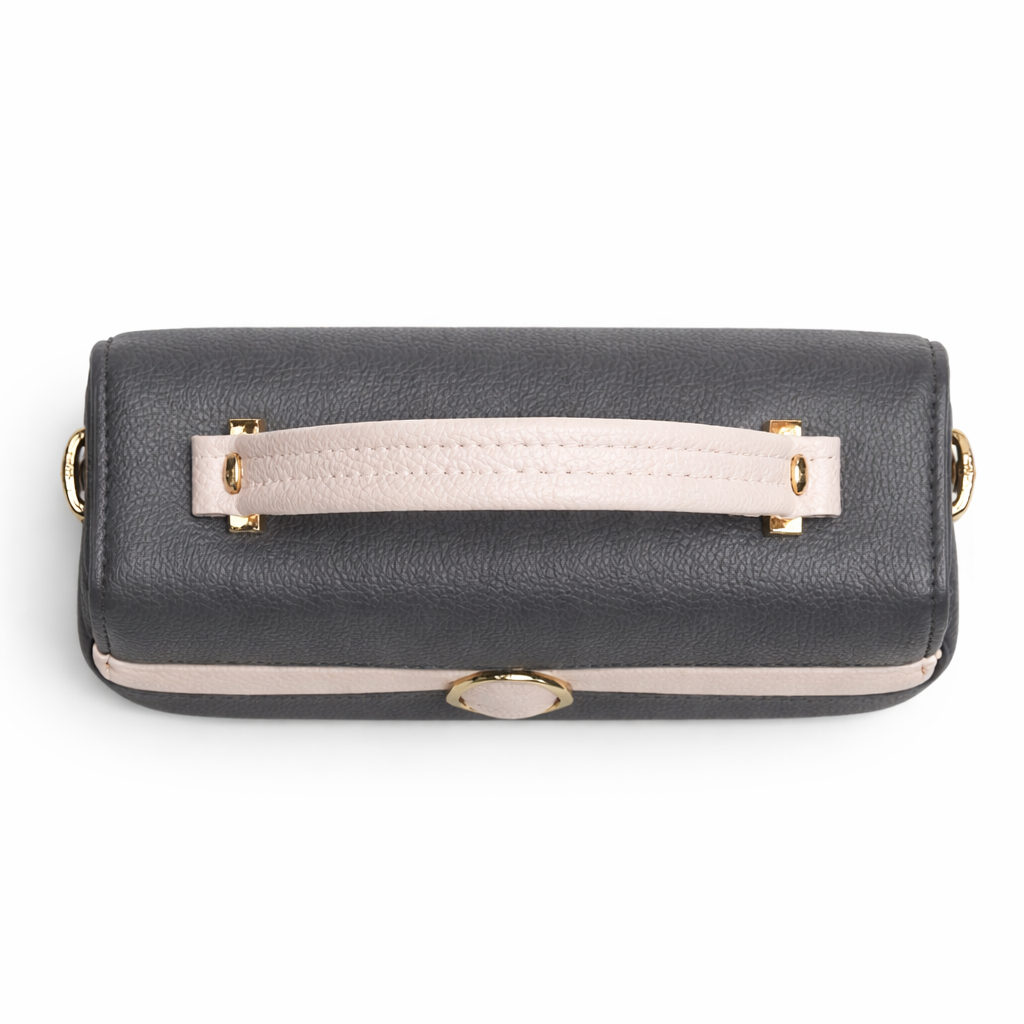 Black handbag with a beige handle on a white background