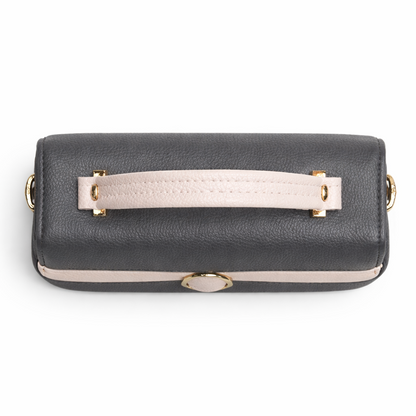 Black handbag with a beige handle on a white background